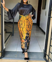 2PC Summer Elegance: African Women's with Loose Flare Sleeve Top and Printed Skirt - Flexi Africa - Flexi Africa offers Free Delivery Worldwide - Vibrant African traditional clothing showcasing bold prints and intricate designs