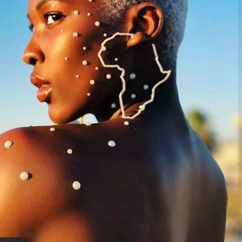 African Map Statement Earrings: Bold, Gold Colored Ornaments Traditional Ethnic Designs - Flexi Africa - Flexi Africa offers Free Delivery Worldwide - Vibrant African traditional clothing showcasing bold prints and intricate designs